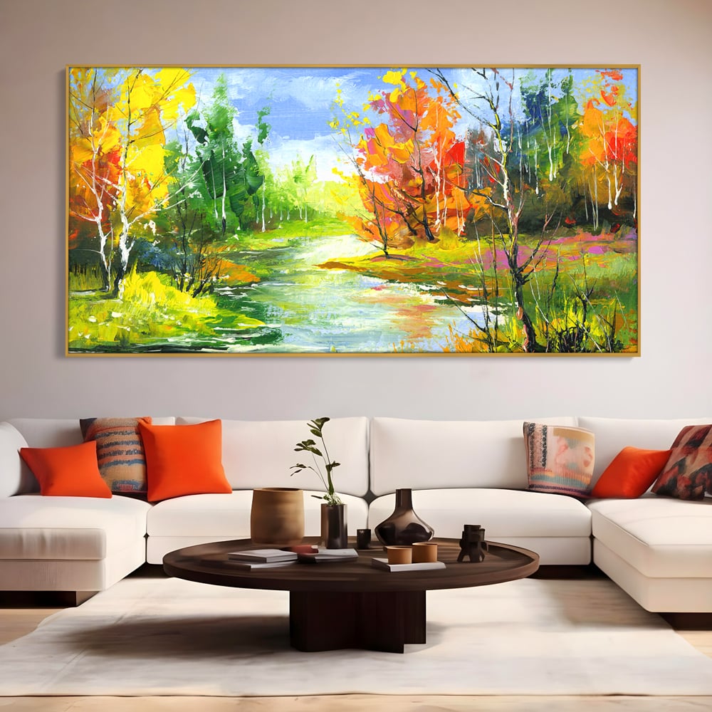Tablou canvas cu pictura peisaj de toamna cu rau, in rama de aluminiu auriu, pe perete intr-un living